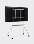 Pedestal Moon PRO TV Stand in Chrome, large mobile TV stand with a shelf, seen from behind showing the frame and shelf