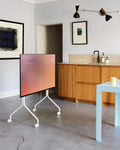 Pedestal Wheels in Pearl, replacement TV stand wheels, fitted to a Pearl stand in a room beside a kitchen