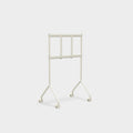 Pedestal Moon Light TV Stand in Pearl, compact steel TV stand on wheels, seen from behind without a screen fitted
