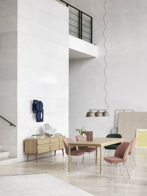 high ceiling scandinavian modern dining room interior with furniture and lighting from muuto