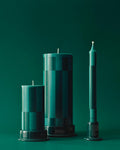 HAY Column Candle, Large, Green and Dark Green, stearin pillar candles, two sizes with a taper on holders against a green backdrop