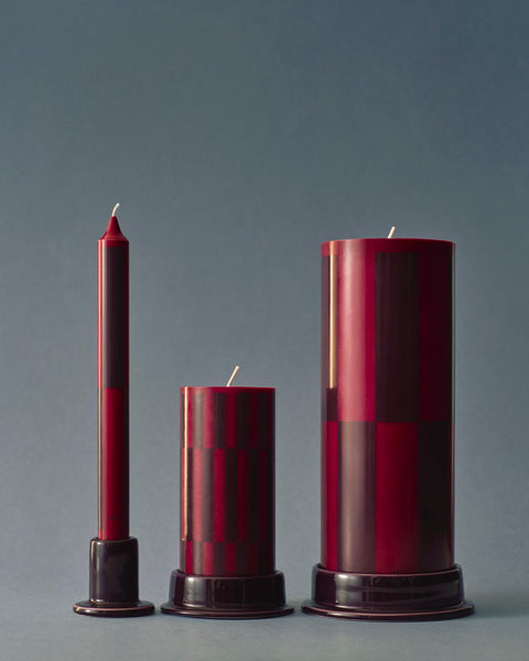HAY Column Candle, Large, Wine and Bordeaux Check, stearin pillar candles, two sizes with a taper on holders, grey blue backdrop
