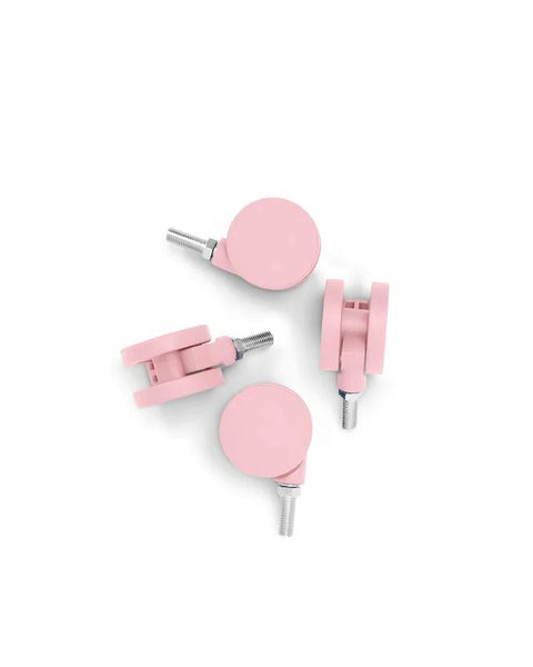 Pedestal Wheels in Bubble Gum, set of four furniture wheels, on a plain white background