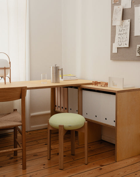 Pioneer Stool at home workspace, oak frame with soft green upholstered seat