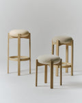 Fredericia Pioneer stools shown in bar counter and low heights in natural oak with upholstered seats, modern Scandinavian design