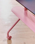 Pedestal Moon Shelf in Bubble Gum, steel shelf for a TV stand, fitted to a Bubble Gum stand on a wooden floor