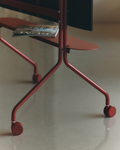 Pedestal Moon Shelf in Burnin' Red, steel shelf for a TV stand, fitted to a Burnin' Red stand holding a screen