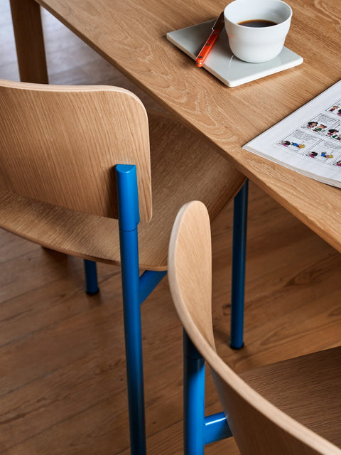 Minimalist and colourful dining chair with wood frame and backrest and blue frame