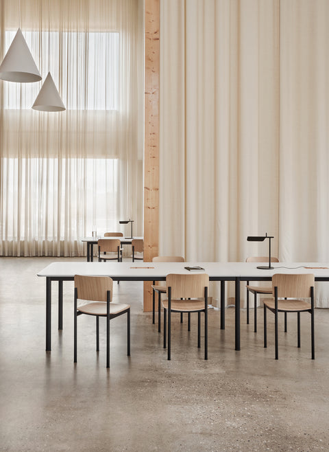 plan chair in an office by fredericia furniture