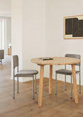 Fredericia Plan Chairs upholstered in grey fabric with brushed chrome legs and solid oak round dining table