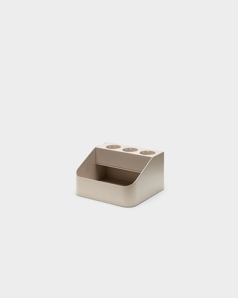 Pedestal Power Bar Tray in Oat, steel power bar holder, seen from the front with the opening facing the camera