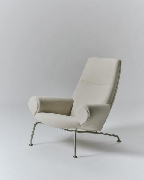 Wegner Queen Chair by Fredericia three quarter studio view Hallingdal 103 light beige upholstery on steel base