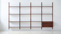 DK3 Royal System Shelving 4 Bay with Drawers in Walnut and Brass, walnut wall shelving, fourteen shelves and a drawer cabinet, front view