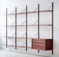 DK3 Royal System Shelving 4 Bay with Drawers in Walnut and Brass, walnut wall shelving, fourteen shelves and a drawer cabinet, angled view