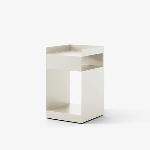 Rotate SC73 Side Table in Ivory by &Tradition – minimalist cream-coloured steel side table with asymmetric form.