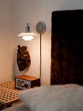 ph 2/1 wall mounted lamp above a bedside table