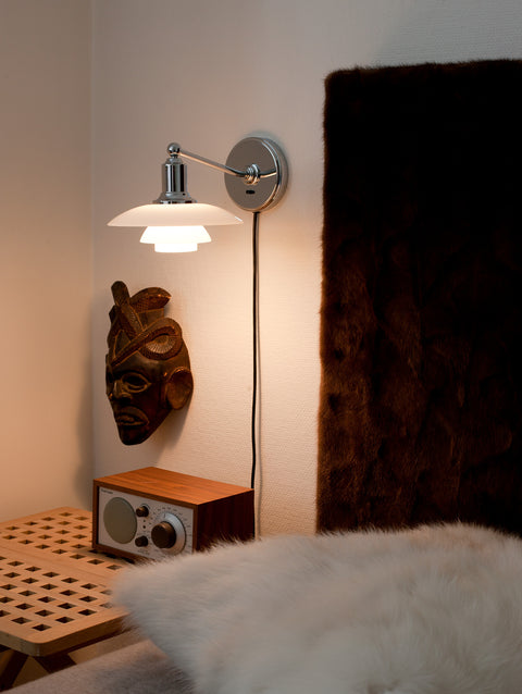 ph 2/1 wall mounted lamp above a bedside table