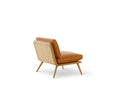 Side view of Fredericia’s Spine Lounge Chair showcasing sculptural lines and Danish craftsmanship