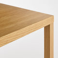 Blu Dot Strut Coffee Table corner detail showing oak top and wood leg joinery