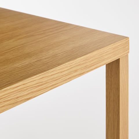 Blu Dot Strut Coffee Table corner detail showing oak top and wood leg joinery