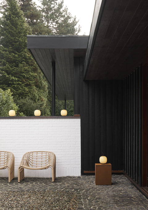 minimalist exterior with modern brass portable lamps