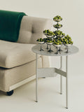 HAY Italian Ice Cup, Stainless Steel, stainless steel ice cream cup, a stack of cups filled with green olives on a grey table by a cream sofa