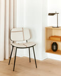 Fredericia Søborg Chair shown in minimalist interior with shelving unit