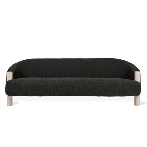 Gus Modern Spadina Sofa in Node Nocturne black boucle fabric with curved barrel back and natural ash wood legs