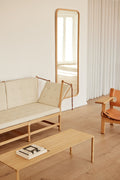 Scandinavian living room with Fredericia Spokeback Sofa in cream next to the Spanish Chair and Piloti oak coffee table