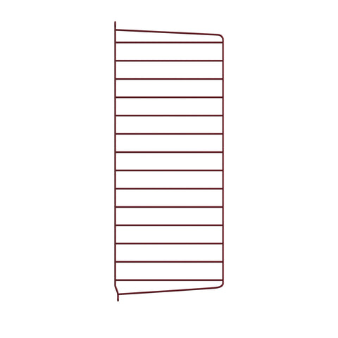String System wall panel in dark red, a steel side panel that mounts to the wall for the String shelving system