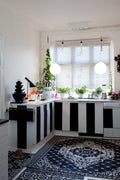 black and white kitchen cabinets with bubble light pendant 