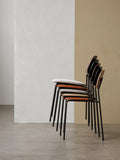 Audo Copenhagen Co Dining Chair, Non-Upholstered, side view of five Co Dining Chairs stacked in various upholstery and wood veneer finishes against a two-tone wall