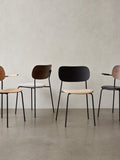 Audo Copenhagen Co Dining Chair, Non-Upholstered, row of four Co Dining Chairs with black steel frames, showcasing various oak veneer and upholstered finishes