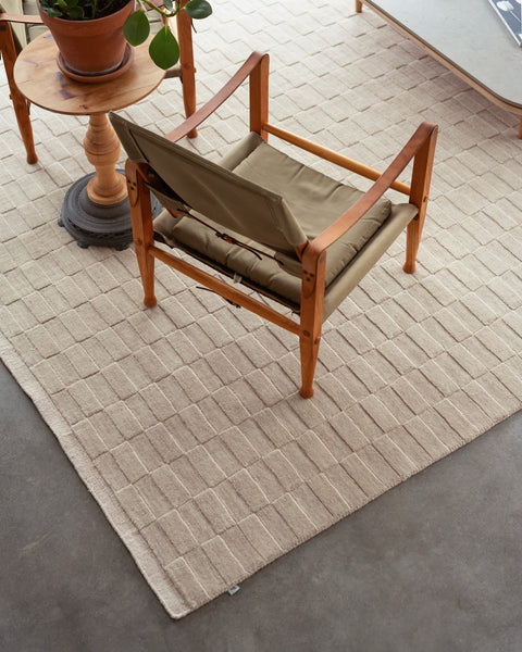 scandinavian area rug and lounge chair