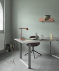 Stylish Muuto folded wall shelves displayed in contemporary home office with clean lines