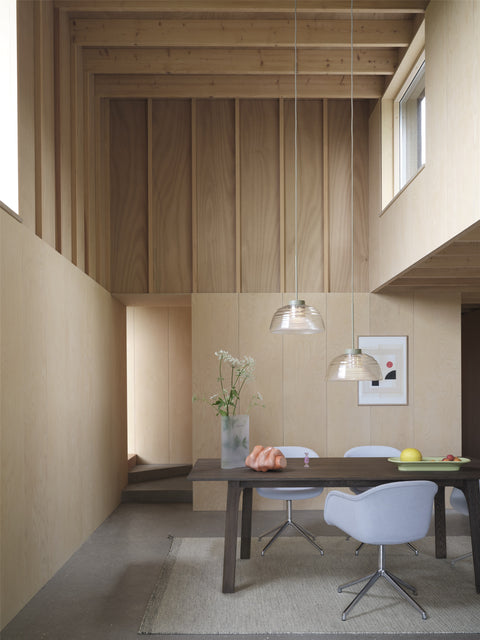 scandinavian interior and wood panel walls with furniture by Muuto 