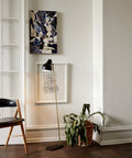 black vl38 floor lamp designed by vilhelm lauritzen in a scandinavian home for louis poulsen