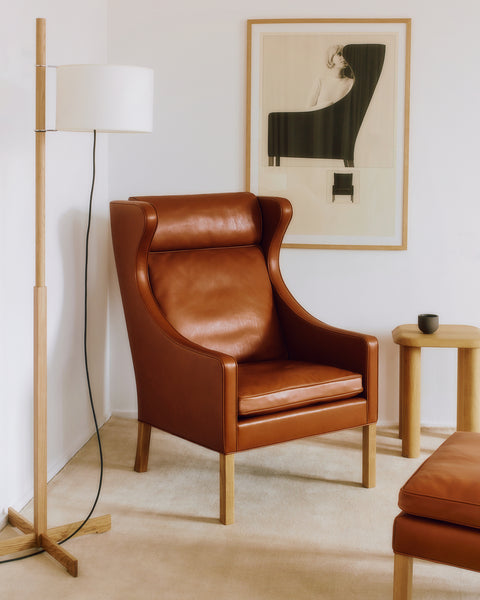 Mogensen Wing Chair in cognac leather with framed art and side tables, bright living room scene, Scandinavian lounge chair, Canada