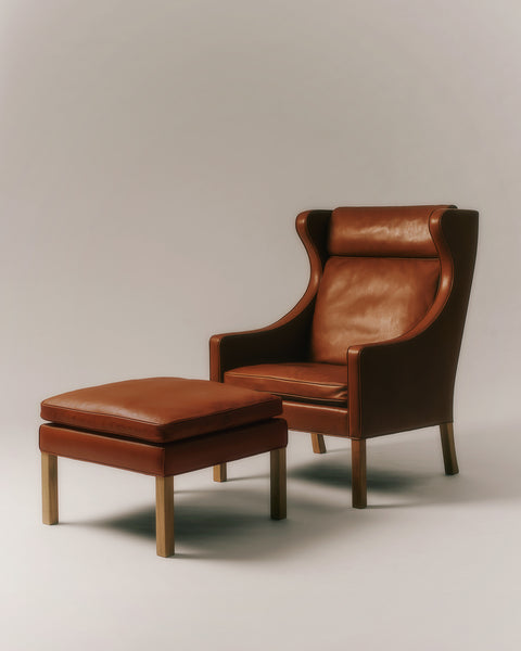 Mogensen Wing Chair with matching ottoman in studio, cognac leather and oak legs, classic Scandinavian lounge set by Fredericia, Canada