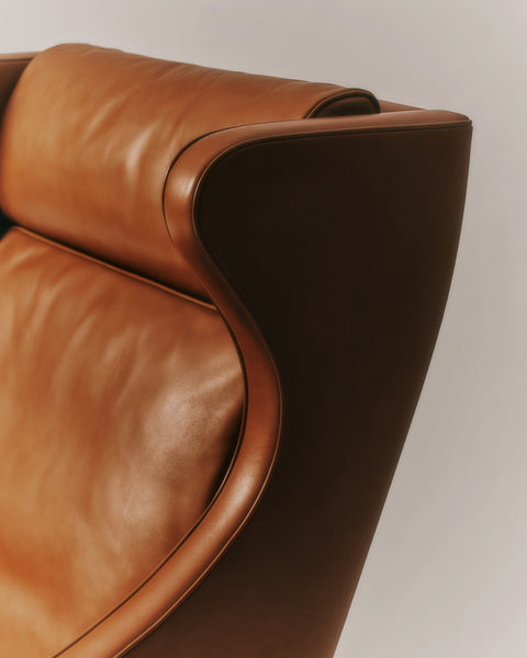 Close up of Mogensen Wing Chair leather and curved wing detail with headrest, premium upholstery craftsmanship by Fredericia, Canada