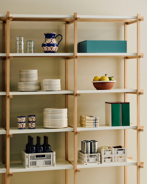 HAY Tin Container, X-Large, Off-White, Burgundy and Green, lidded tinplate storage tin, on pale wood shelving with plates, crates and a jug