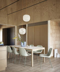 scandinavian dining room with wood panelling with furniture and lighting from muuto