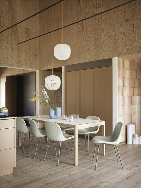 scandinavian dining room with wood panelling with furniture and lighting from muuto