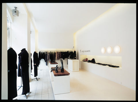 aj eklipta wall lamp in a clothing store designed by louis poulsen