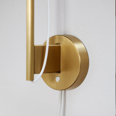 brass wall lamp detail by louis poulsen