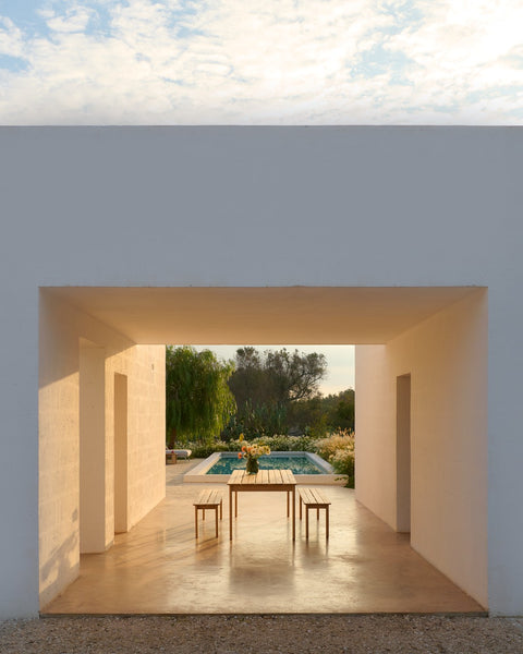 Muuto Assemble teak dining table and benches in modern outdoor setting