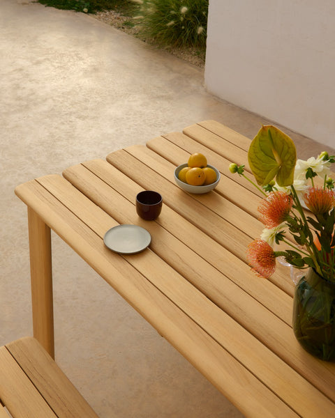 Close up of Muuto Assemble teak table with slatted top and outdoor styling