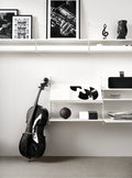 White String™ system with Magazine Shelf, styled with vinyl records and black cello in modern interior
