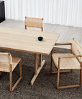 lifestyle image  of bm62 dining chair with danish caning designed by Borge mogensen for fredericia