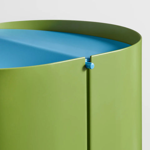 Blu Dot Binwell Wastebasket in Grasshopper green detail shot showing swing-top lid hinge mechanism